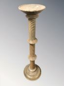 A turned barley twist torchere, height 101 cm.