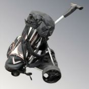 A Pro Master electric golf caddy with Callaway golf club bag.