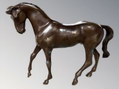 A patinated bronze figure of a horse, 20th century, realistically modelled in cantering pose,