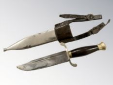 An oriental dress bayonet in scabbard with leather frog,