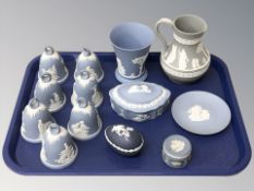 A group of Wedgwood blue and white jasperware bells, similar trinket box, beaker,
