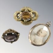 A memorial locket in rose gold oval frame,