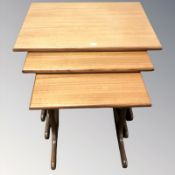 A G Plan teak nest of three tables, width 56 cm.