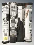 Four rolls of roofing felt.