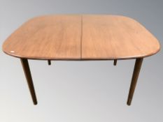 A 20th century G Plan teak extending dining table with internal leaf,