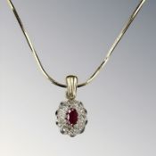 A 9ct gold ruby and diamond cluster pendant on chain CONDITION REPORT: 5.