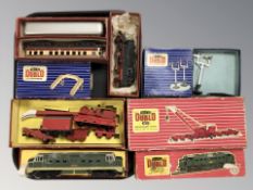 A Trix tin plate locomotive, two further passenger cars, Hornby locomotive and crane in boxes,
