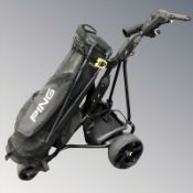 A Powakaddy electric golf caddy with Ping golf club bag.