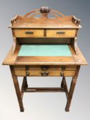 An Arts and Crafts style lady's mahogany writing desk, 70 cm W x 48 cm D x 115 cm H.