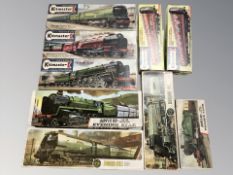 A group of scale model locomotives and passenger cars including Airfix and Kit Master
