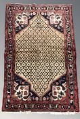 A Sarab rug, 254 cm x 130 cm.