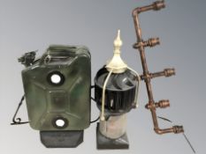 A jerry can light, a chimney cowl and a decorative bracket.