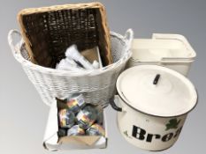 Two wicker baskets, an enameled housekeepers box, a further bread bin, several spools of twine.