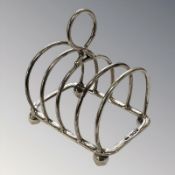 A silver five-bar toast rack, Sheffield 1949, length 7 cm. CONDITION REPORT: 46.4g.