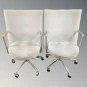 A pair of Danish Erik Jorgensen designed 'Partner' chrome-framed executive swivel armchairs,
