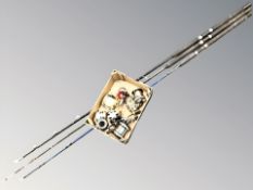 Three Shakespeare fishing rods and box of various reels.