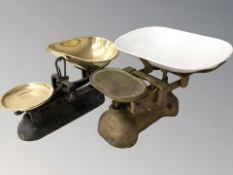 A set of cast iron and brass scales and a further set with enameled pan.