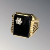 A gent's gold, black onyx and diamond signet ring, indistinctly stamped,