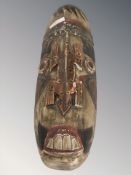 An Angolan carved and painted wooden mask, length 48 cm.