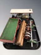 A Mamod steam engine, a wagon and a further wagon with logs.