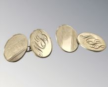A pair of 9ct gold cuff links engraved with the initials MJS CONDITION REPORT: 3.