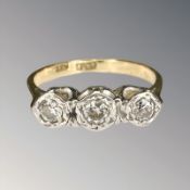 An 18ct gold and platinum three stone diamond ring, size O½ CONDITION REPORT: 3.