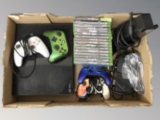 An Xbox console, controllers, leads and various games.