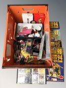 A quantity of Pokemon collectibles including cards, football cards and magazines, etc.