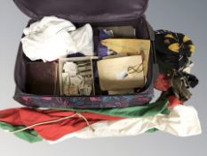 A luggage case containing Brooke Bond tea cards, schoolboy's caps and ties, books, etc.