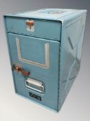 An enameled metal storage box, height 47 cm.
