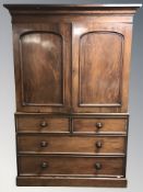 A Victorian mahogany linen press, 143 cm W x 58 cm D x 211 cm H.