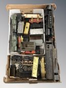 Assorted tin plate locomotives and other rolling stock.