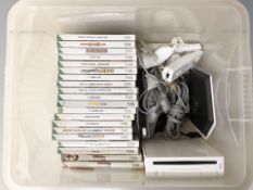 A Nintendo Wii console, controllers, leads and various games.