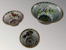 Three graduated pliqué a jour bowls,