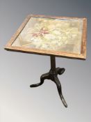 A Victorian mahogany tripod table with tapestry inset top,