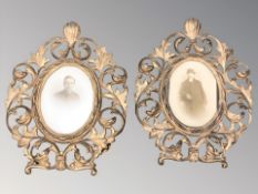 A pair of ornate gilt metal photo frames containing monochrome portrait photographs of gentleman,