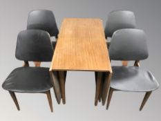 A 20th century Elliotts of Newbury teak extending dining table,