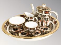 A Royal Crown Derby miniature Imari four piece tea service on oval tray, pattern 1128,