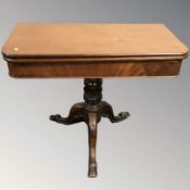 A 19th century mahogany turnover top tea table,