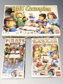 Three Lego sets in boxes