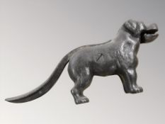 A cast iron nut cracker in the form of a dog,