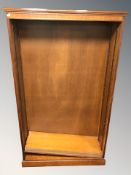 A reproduction cherry wood open bookcase with adjustable shelves,