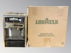 A Lavazza espresso machine in box