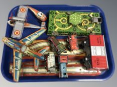 A group of 20th century tin plate wind up rolling stock, track, round a bout, helicopter,