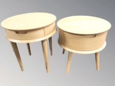 Two modern oak veneered circular lamp tables fitted drawers,