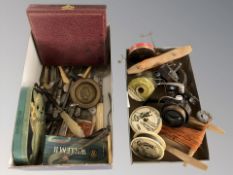 A group of fishing reels including Diawa, tins, metal wares,