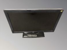 An LG 37 inch LCD TV with lead and remote