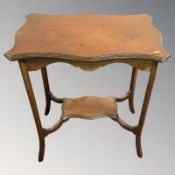 An Edwardian mahogany occasional table,