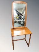A 20th century teak lamp table,