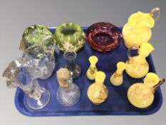 A group of marbled yellow glass jugs, cranberry glass bowl,